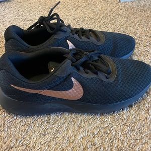 Black and gold Nike shoes in excellent condition!
